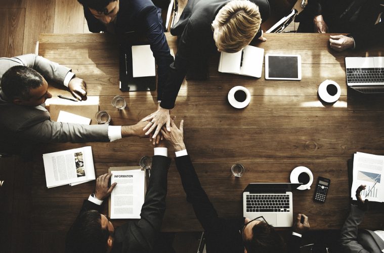 Image of people working at a desk.