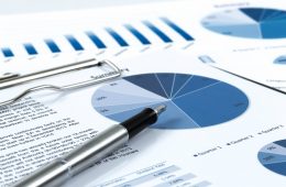 Image if pen on top of forecasting report.