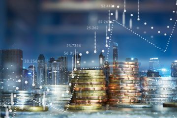 Picture of coins against city skyline