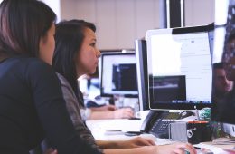 Forecasters working together at desk